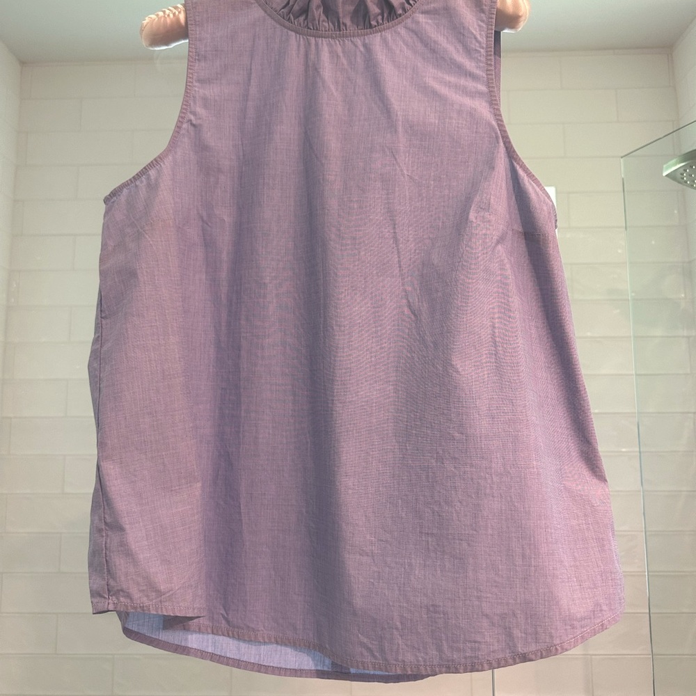 J. Crew sleeveless blouse with small ruffle neck.